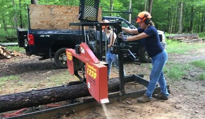 lumb_5_3670759379 woman working the UConn sawmill in the forest